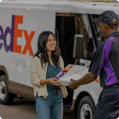 FedEx logo with delivery person handing package to customer